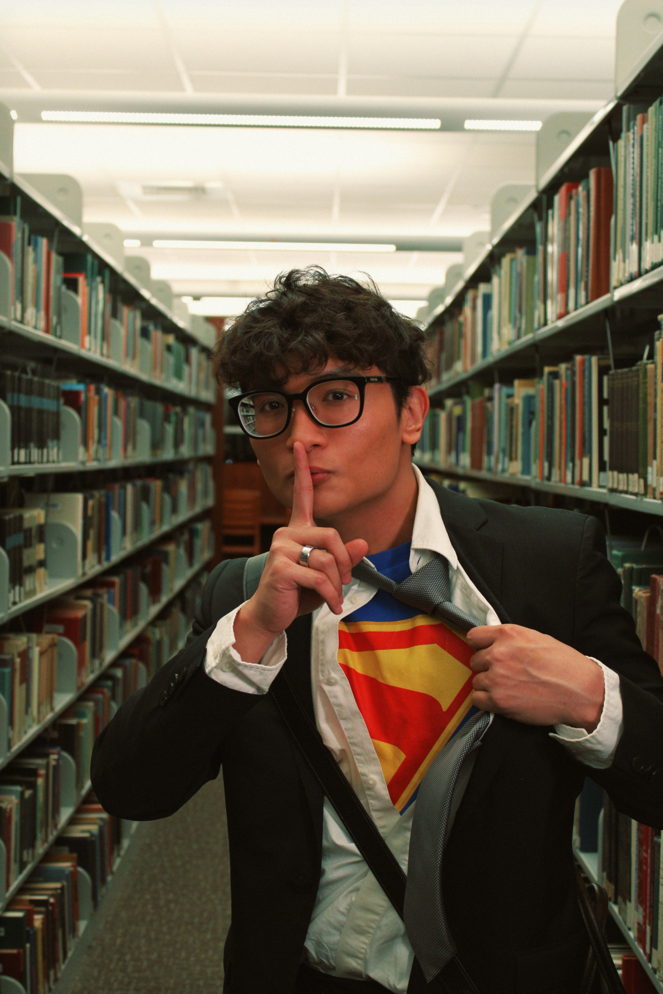 Halloween character portrait of Mark Jayson Farol inside a library aisle.